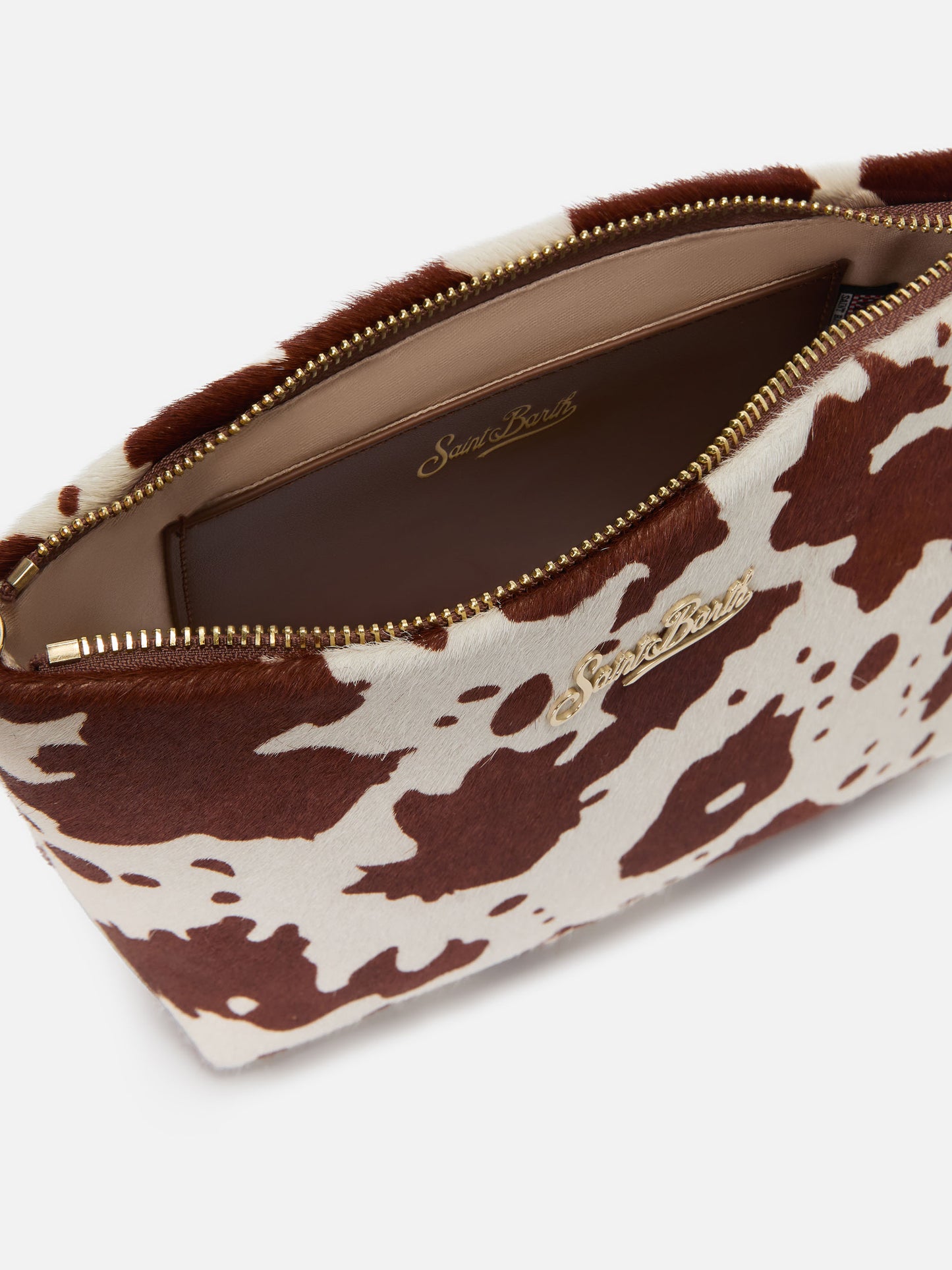 Aline bag in cow print pony hair with metal logo plaque