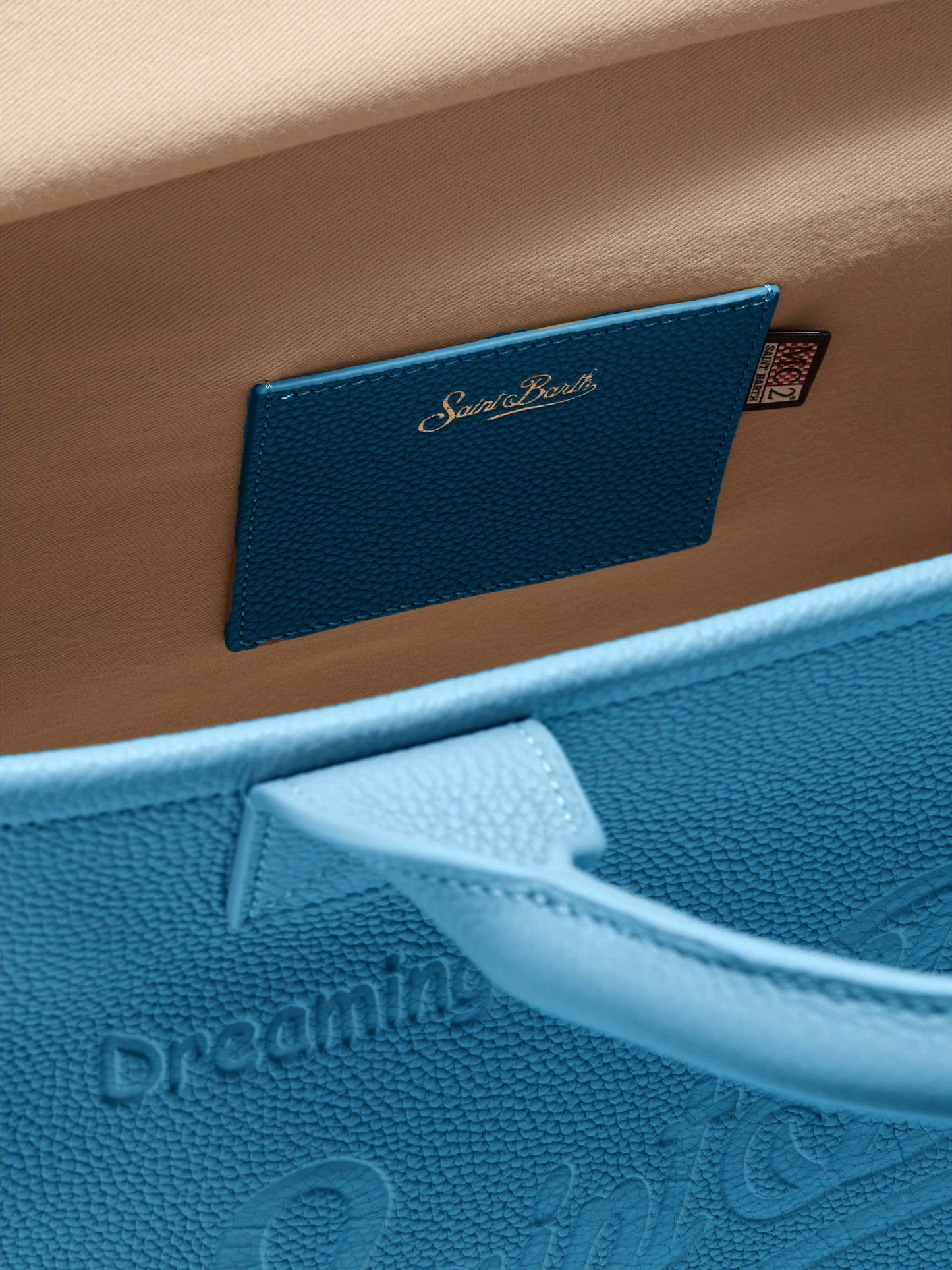 Vanity Bag Midi Schultertasche aus gehämmertem Leder in Türkis.