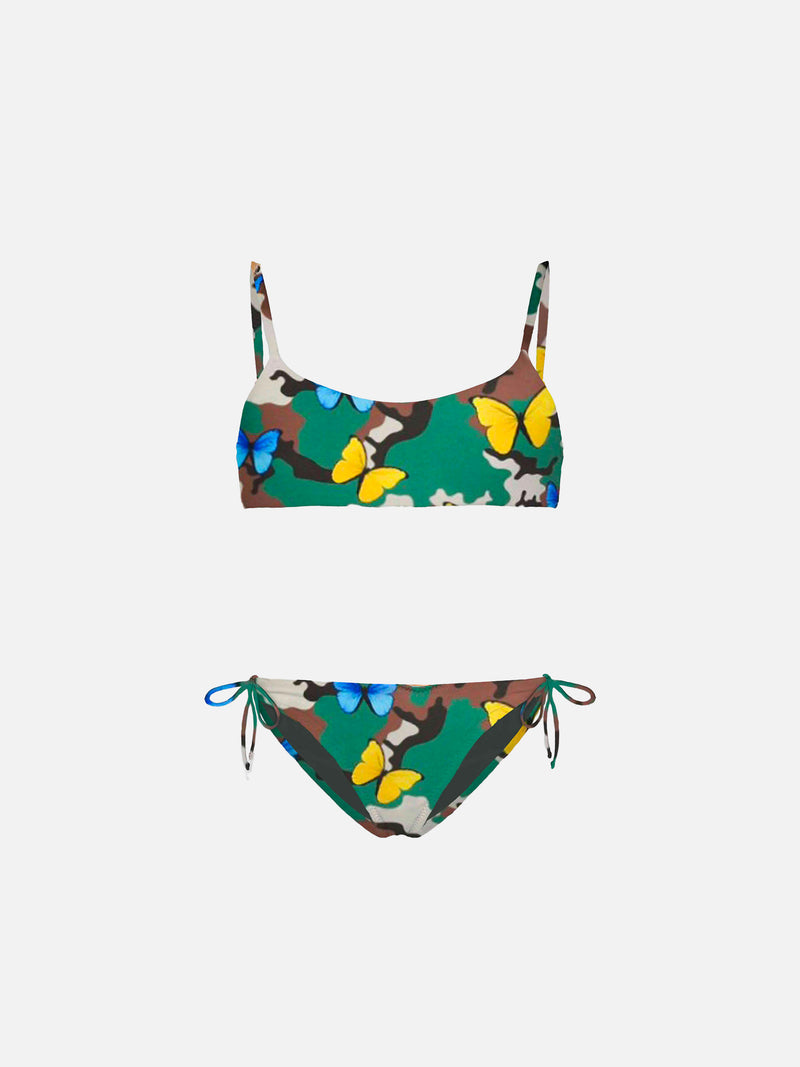 Girl bikini butterfly print on camouflage background