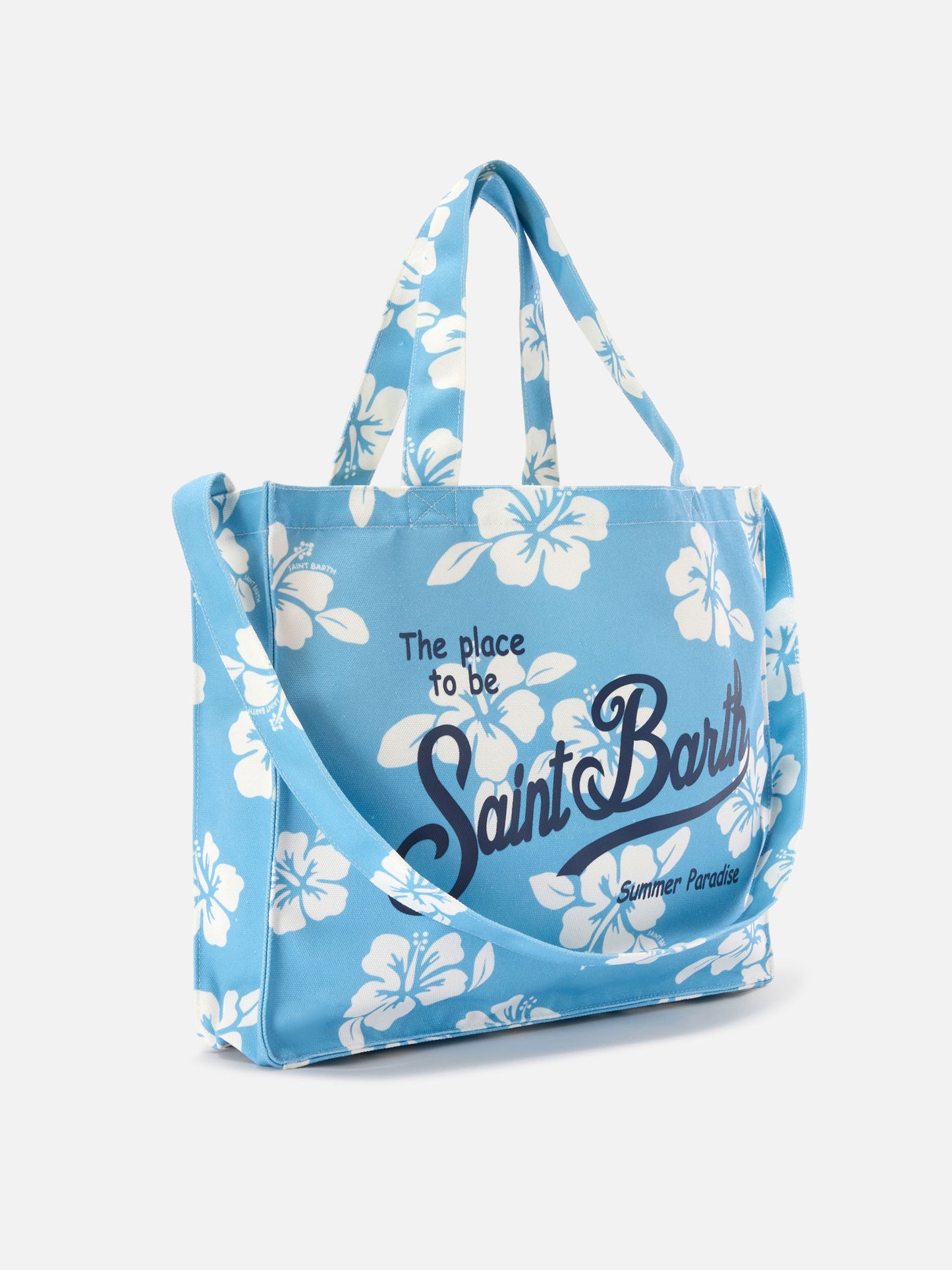 Essential canvas tote bag with light blue hibiscus print and contrasting logo