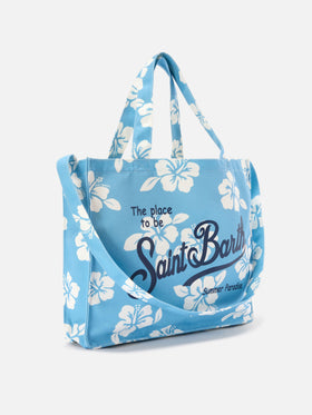 Essential canvas tote bag with light blue hibiscus print and contrasting logo