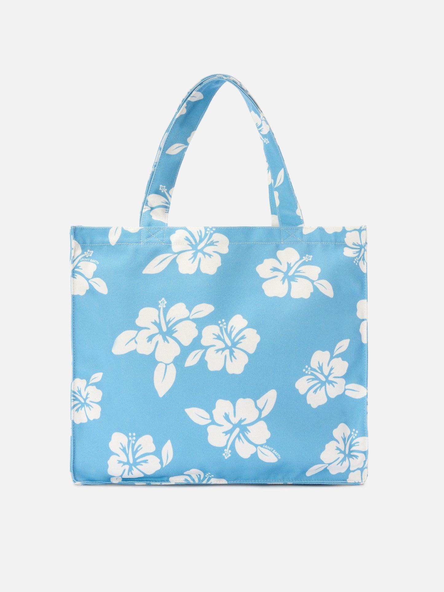 Essential canvas tote bag with light blue hibiscus print and contrasting logo
