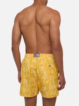 Man light fabric swim shorts with ochre paisley print