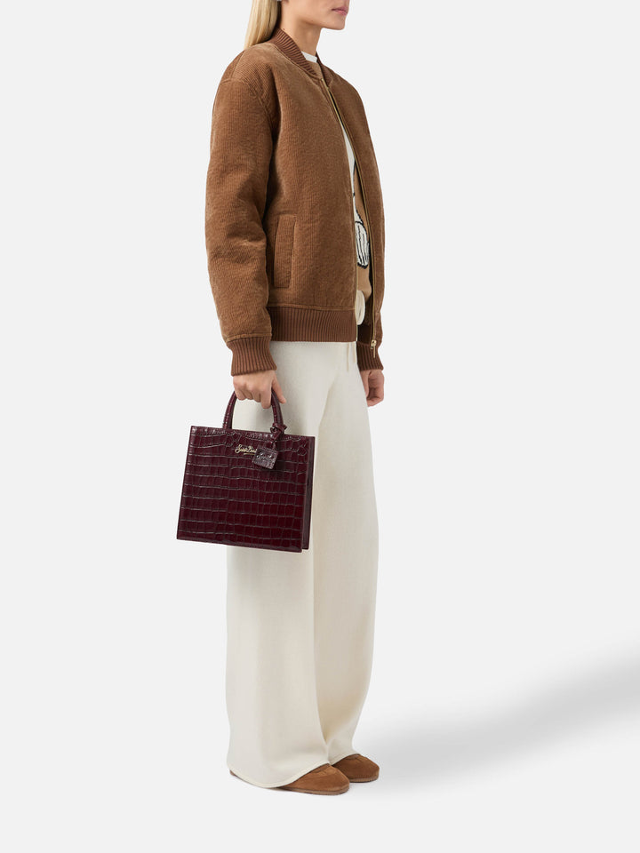 Shop Bag Midi Handbag in burgundy crocodile-print leather