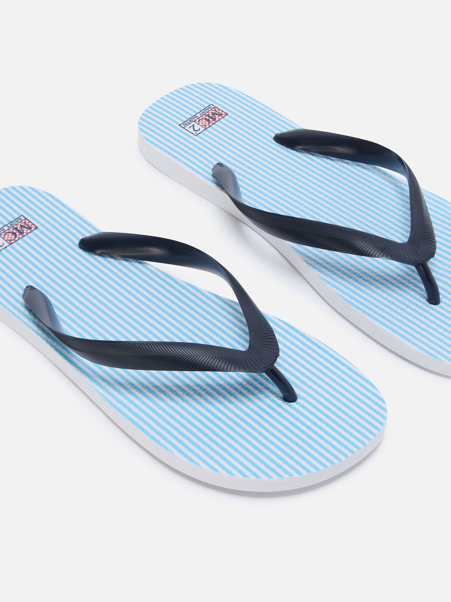 Tommy rubber slip-on flip flops with light blue stripes