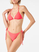 Woman fluo red triangle bikini