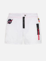 White swim shorts with patches