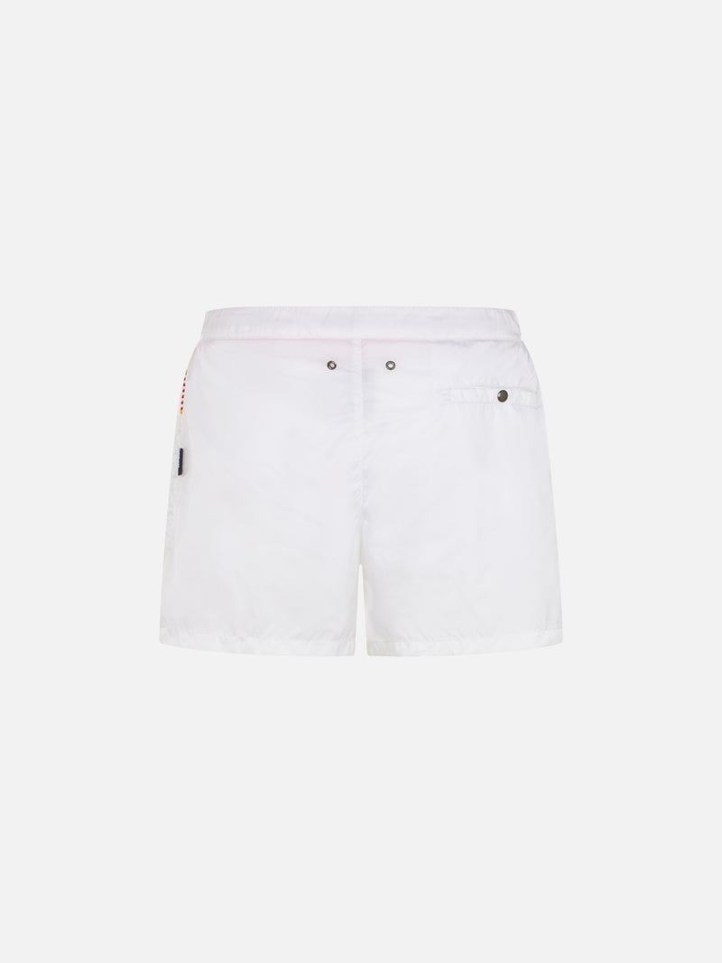 White swim shorts with patches