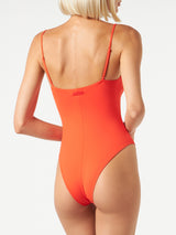 Woman orange one piece swimsuit