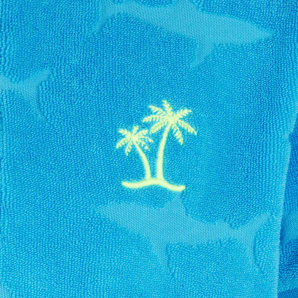 Blaues Jungen-Poloshirt mit aufgeprägten Haifischen aus Frottee